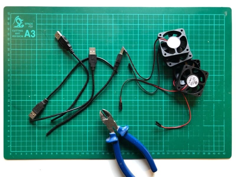 Donor USB cables and a pile of cooling fans