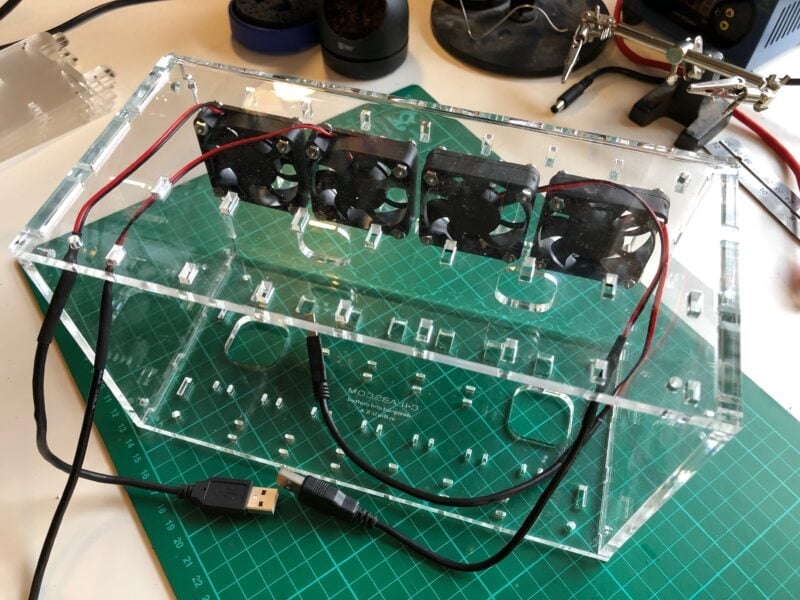 The four rear exhaust fans are mounted in the cluster case